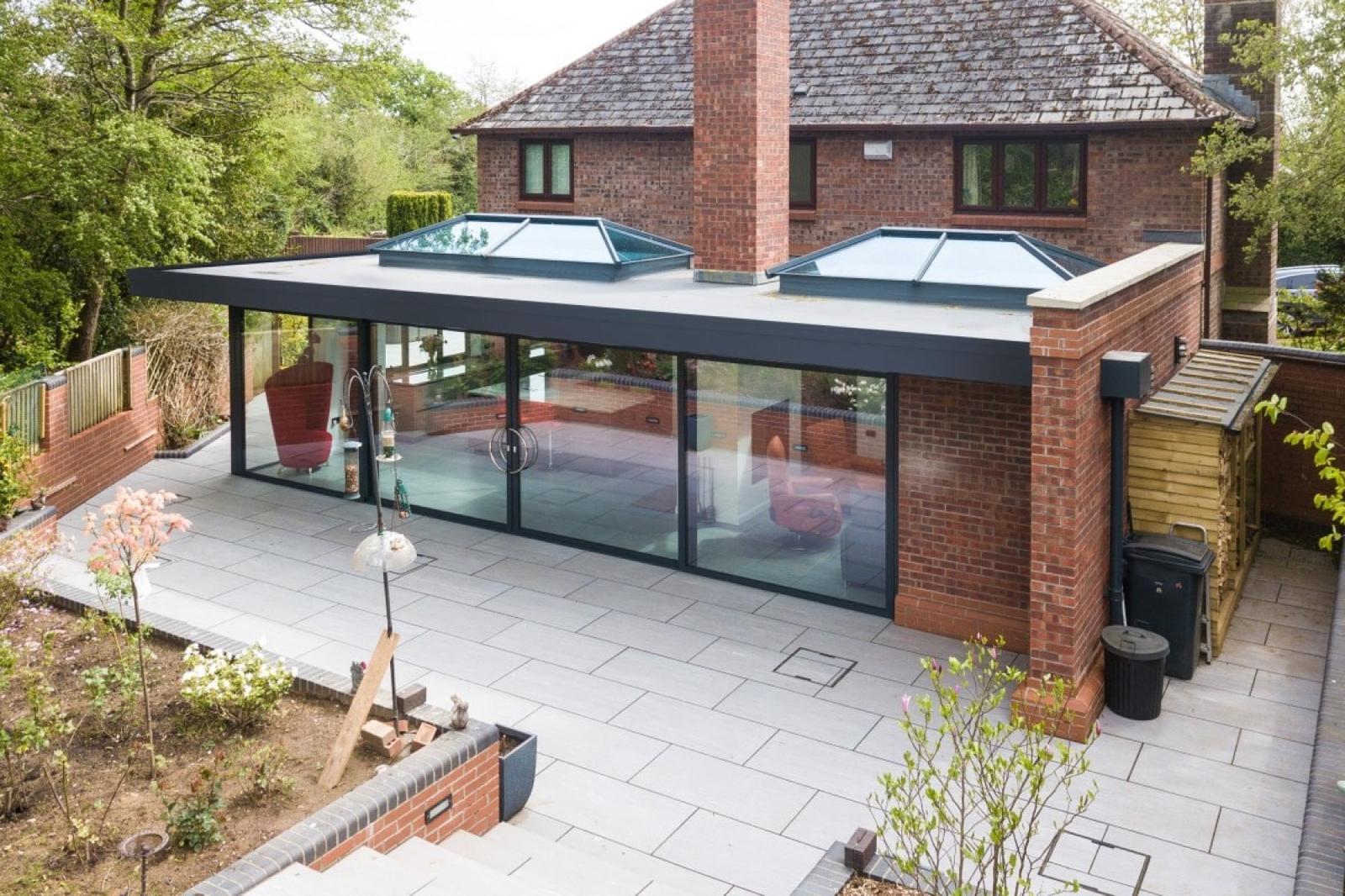 Stone bungalow with sandstone patio